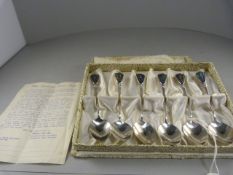 A boxed set of six silver coffee spoons with original receipt in original box - made from Paua