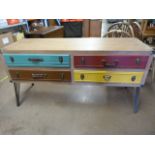 A Modern Chest of Four coloured drawers on metal legs