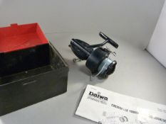 A Daiwa Crossfire boxed spinning wheel