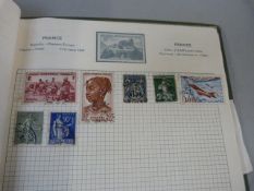A small stamp album containing mainly Canadian, Indian etc
