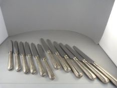 A Set of 12 silver handled knives - assay sheffield 1970