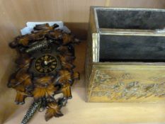 An Actim Cuckoo clock and a brass magazine rack