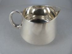 A Hallmarked Silver milk jug assayed in London 1940 - weight 126.8g