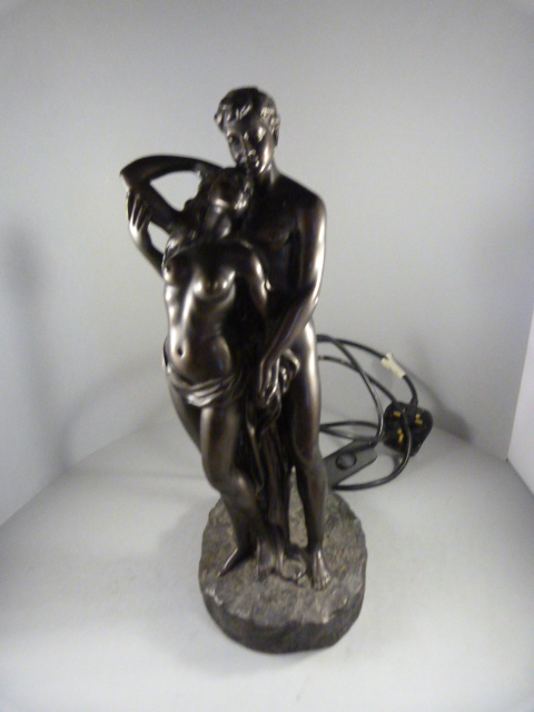 A Bronzed figure of lovers in the form of a lamp (glass shade missing)