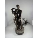 A Bronzed figure of lovers in the form of a lamp (glass shade missing)