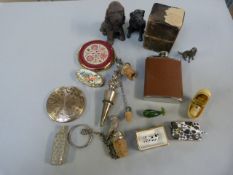 A quantity of interesting figures to include lead figure of a dog, hip flask and other pieces etc