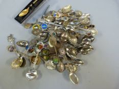 A Large quantity of collector teaspoons to include one Hallmarked Silver - Ottery St Mary - stand in