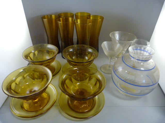 A quantity of mainly amber coloured glassware, and three other pieces