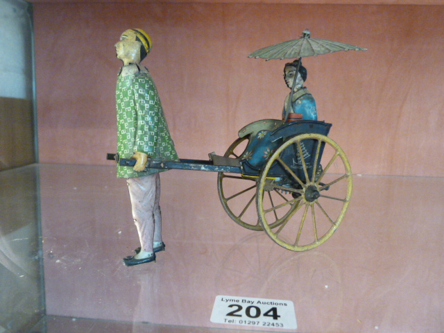 Lehmann clockwork painted tinplate Masuyama rickshaw (773). Length approx. 18cm, height approx. - Image 2 of 9