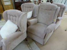 A Cream upholstered sofa suite - consisting of A Two seater sofa, fireside armchair and two manual