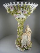 A Continental Large flower encrusted Compote - The stem encrusted with flowers and a seated Lady -
