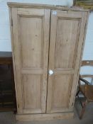An Antique pine two door wardrobe A/F