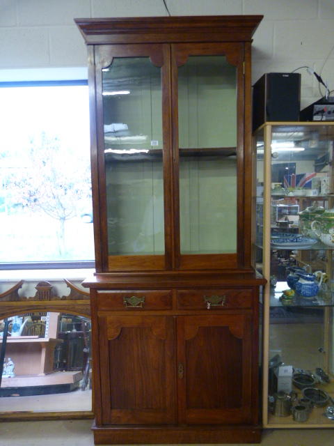 A Small mahogany dresser with glass cabinet over