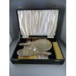 A Boxed Hallmarked Silver backed dressing table set - original box with fold down front.