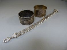 Two Hallmarked Silver napkin rings and a Silver linked chain marked 925. Total weight approx. 143g