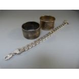 Two Hallmarked Silver napkin rings and a Silver linked chain marked 925. Total weight approx. 143g