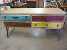 A Modern Chest of Four coloured drawers on metal legs