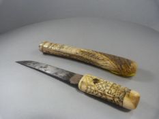 An oriental knife - the scabbard being fully worked ivory, along with the matching handle on the