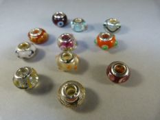 Collection of 11 silver mounted pandora style charms