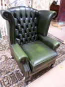Green faux leather button back fireside armchair on cabriole legs