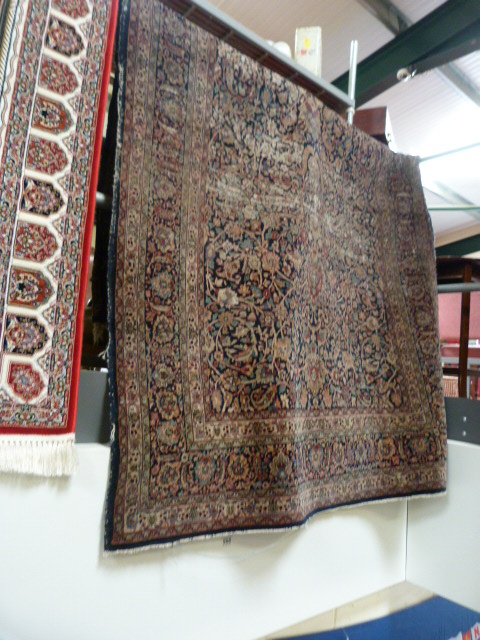 A large blue ground hand made rug - Image 4 of 7