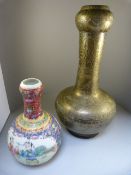 A Chinese Brass garlic neck vase heavily engraved and marked to base and a Chinese famille rose