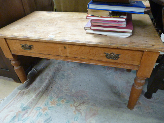 An oak coffee table with single drawer