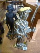 Cast iron doorstop of a soldier and one other