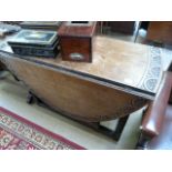 Heavily carved oak drop leaf table with barley twist legs