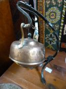 Copper kettle on cast iron hanging trivet