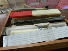 Box containing large quantity of vintage slide rules