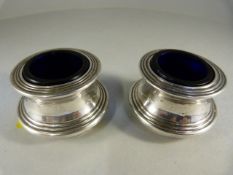 Pair of Hallmarked silver salts with blue Glass Liners