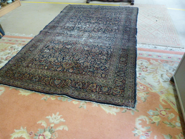 A large blue ground hand made rug - Image 6 of 7