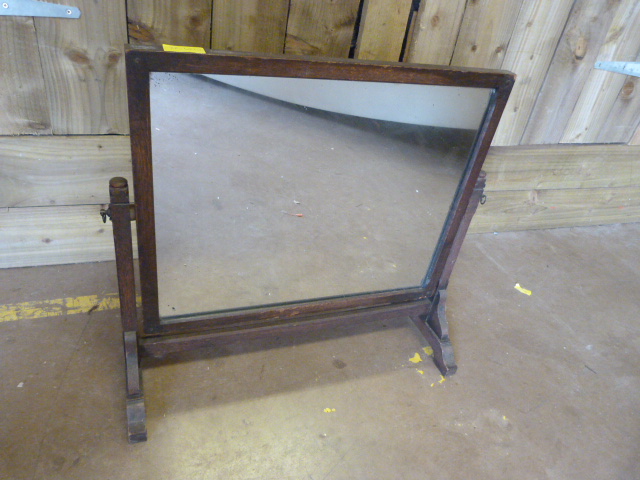 An oak framed toilet mirror