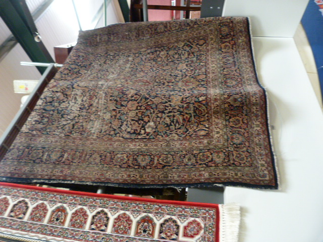 A large blue ground hand made rug - Image 3 of 7