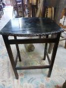 An Ebonised occasional table