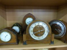 Five various mantle clocks, to include a French lacquered and Gilt clock with enamelled dial