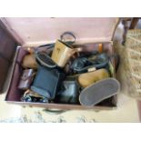 Suitcase containing various binoculars in leather cases
