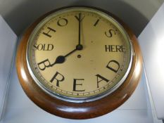 Oak cased Advertising wall clock with handpainted with approx 11.5 inch dial 'Hovis Bread Sold Here'