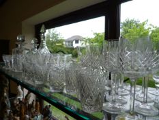 Large quantity of cut glass and three decanters - to include Thomas Webb, Stuart Crystal and a