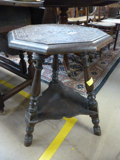 Oak tripod table with carved top