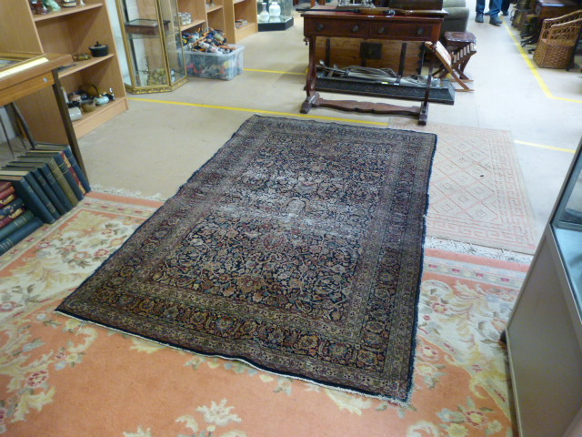 A large blue ground hand made rug - Image 5 of 7