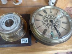 A brass clock and a barometer (A/F) and a serving tray