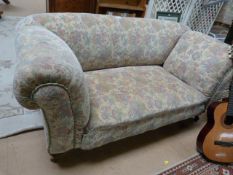 Floral two seater sofa with scroll arms - on oak legs