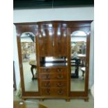 A Mahogany Triple wardrobe with four drawers - (Keys in office)