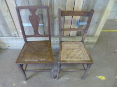 A cane seated chair and one other