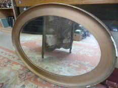 Large oval framed gilt mirror