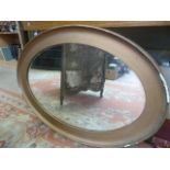 Large oval framed gilt mirror