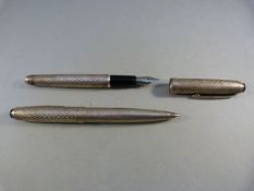 A pair of white metal matching pens, one fountain, one ballpoint. Iridium nib to fountain pen.