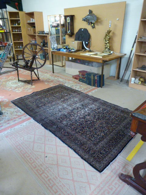 A large blue ground hand made rug - Image 7 of 7